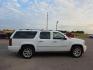 2009 WHITE CHEVROLET SUBURBAN 1500 LTZ (1GNFK36369R) with an 5.3L engine, Automatic transmission, located at 495 Old Highway 20 West, South Sioux City, NE, 68776, (402) 494-2677, 42.458408, -96.443512 - Photo#0