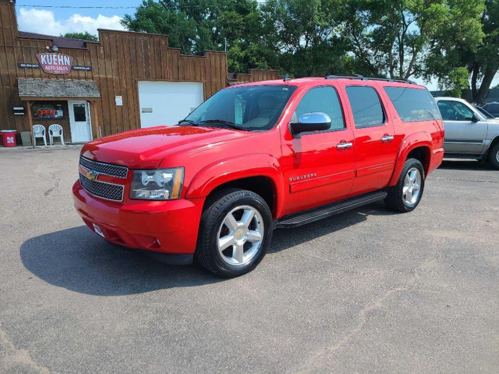 2012 RED CHEVROLET SUBURBAN 1500 LT (1GNSKJE73CR) with an 5.3L engine, Automatic transmission, located at 495 Old Highway 20 West, South Sioux City, NE, 68776, (402) 494-2677, 42.458408, -96.443512 - Photo #0
