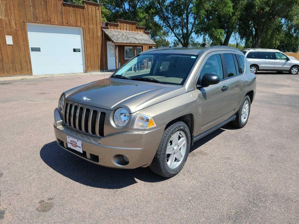 2007 TAN JEEP COMPASS (1J8FF47W77D) with an 2.4L engine, Continuously Variable transmission, located at 495 Old Highway 20 West, South Sioux City, NE, 68776, (402) 494-2677, 42.458408, -96.443512 - Photo #0