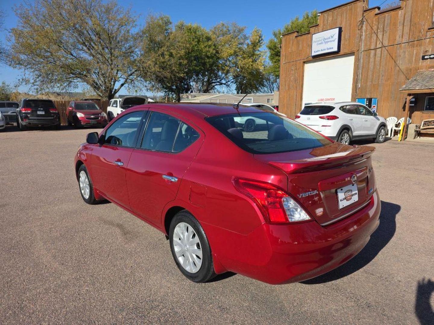 2014 MAROON NISSAN VERSA S (3N1CN7AP5EK) with an 1.6L engine, Continuously Variable transmission, located at 495 Old Highway 20 West, South Sioux City, NE, 68776, (402) 494-2677, 42.458408, -96.443512 - Photo#2