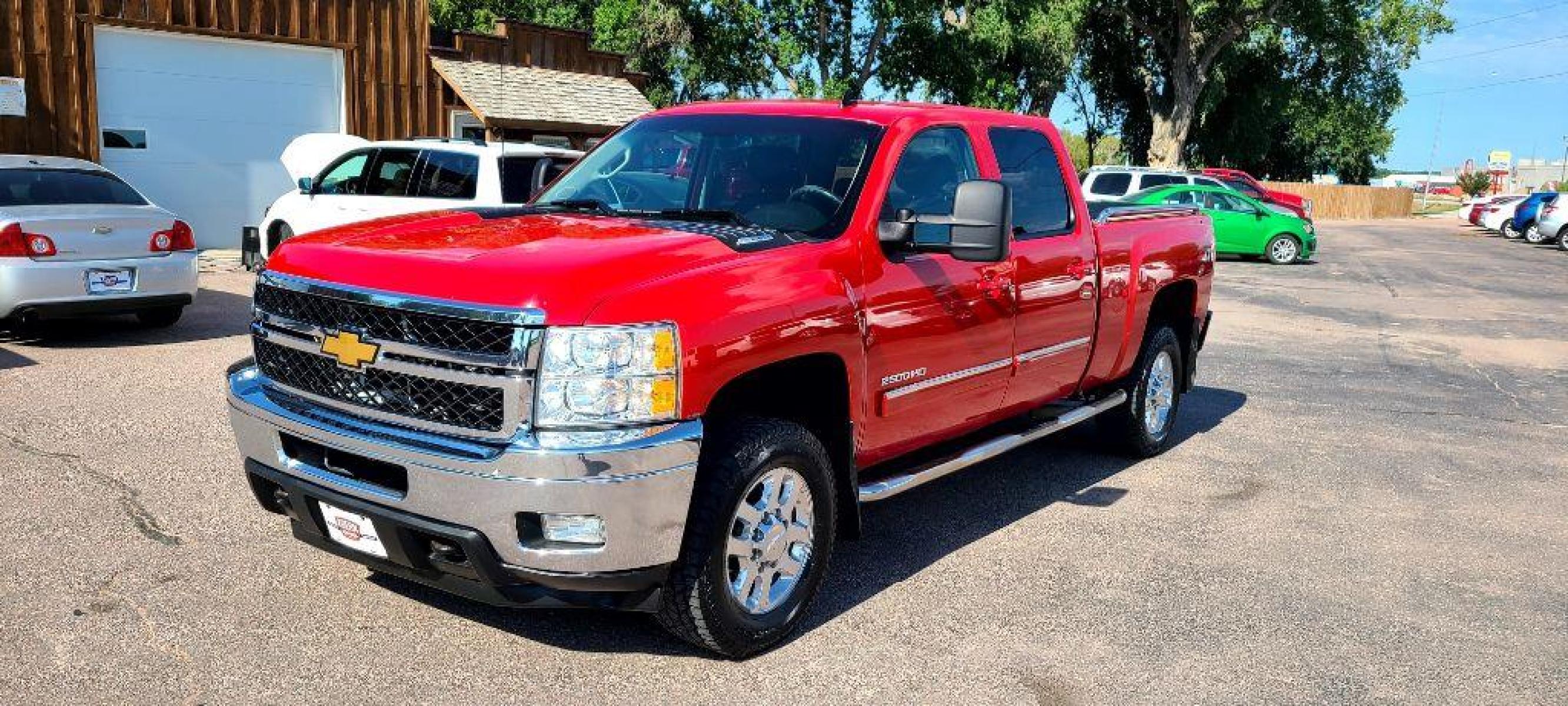 2013 RED CHEVROLET SILVERADO 2500 HEAVY DUTY LTZ (1GC1KYE84DF) with an 6.6L engine, Automatic transmission, located at 495 Old Highway 20 West, South Sioux City, NE, 68776, (402) 494-2677, 42.458408, -96.443512 - Photo #0