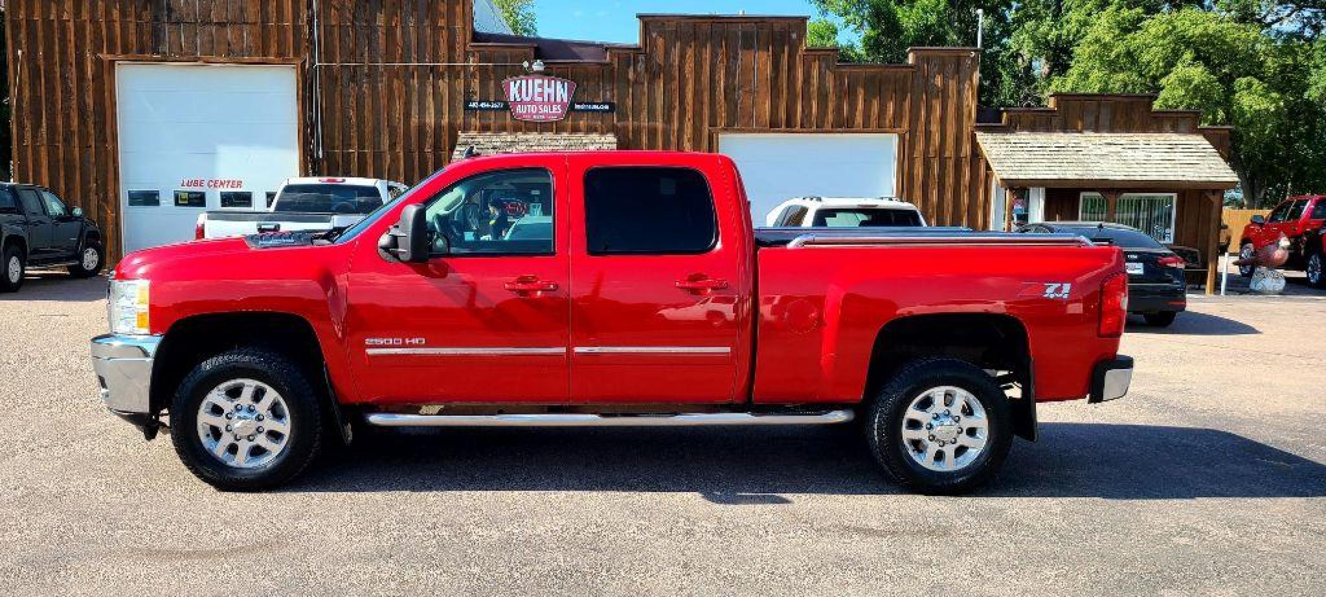 2013 RED CHEVROLET SILVERADO 2500 HEAVY DUTY LTZ (1GC1KYE84DF) with an 6.6L engine, Automatic transmission, located at 495 Old Highway 20 West, South Sioux City, NE, 68776, (402) 494-2677, 42.458408, -96.443512 - Photo #1