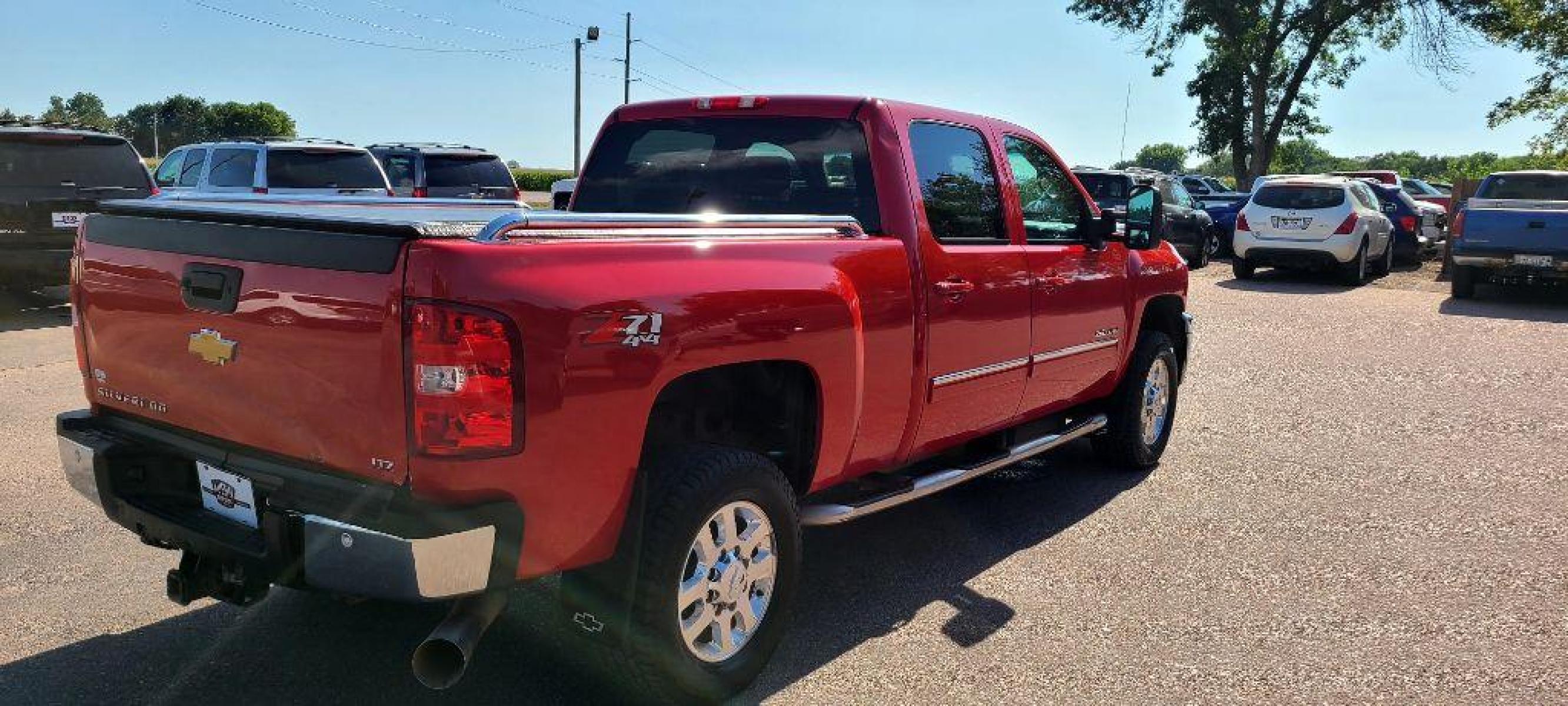2013 RED CHEVROLET SILVERADO 2500 HEAVY DUTY LTZ (1GC1KYE84DF) with an 6.6L engine, Automatic transmission, located at 495 Old Highway 20 West, South Sioux City, NE, 68776, (402) 494-2677, 42.458408, -96.443512 - Photo #3