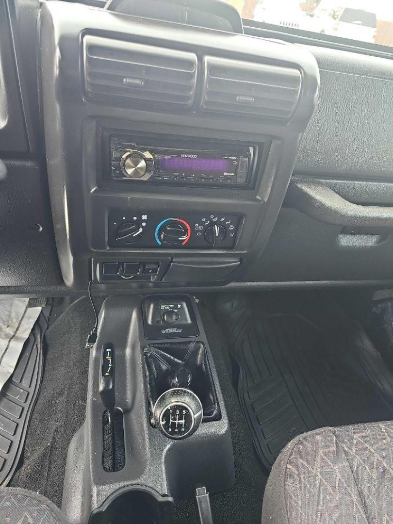 2001 BLUE JEEP WRANGLER / TJ SPORT (1J4FA49S11P) with an 4.0L engine, Automatic transmission, located at 495 Old Highway 20 West, South Sioux City, NE, 68776, (402) 494-2677, 42.458408, -96.443512 - Photo#8