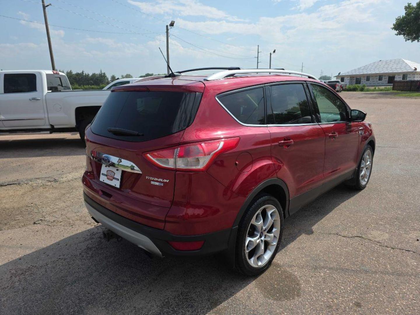 2015 MAROON FORD ESCAPE TITANIUM (1FMCU9J94FU) with an 2.0L engine, Automatic transmission, located at 495 Old Highway 20 West, South Sioux City, NE, 68776, (402) 494-2677, 42.458408, -96.443512 - Photo#2