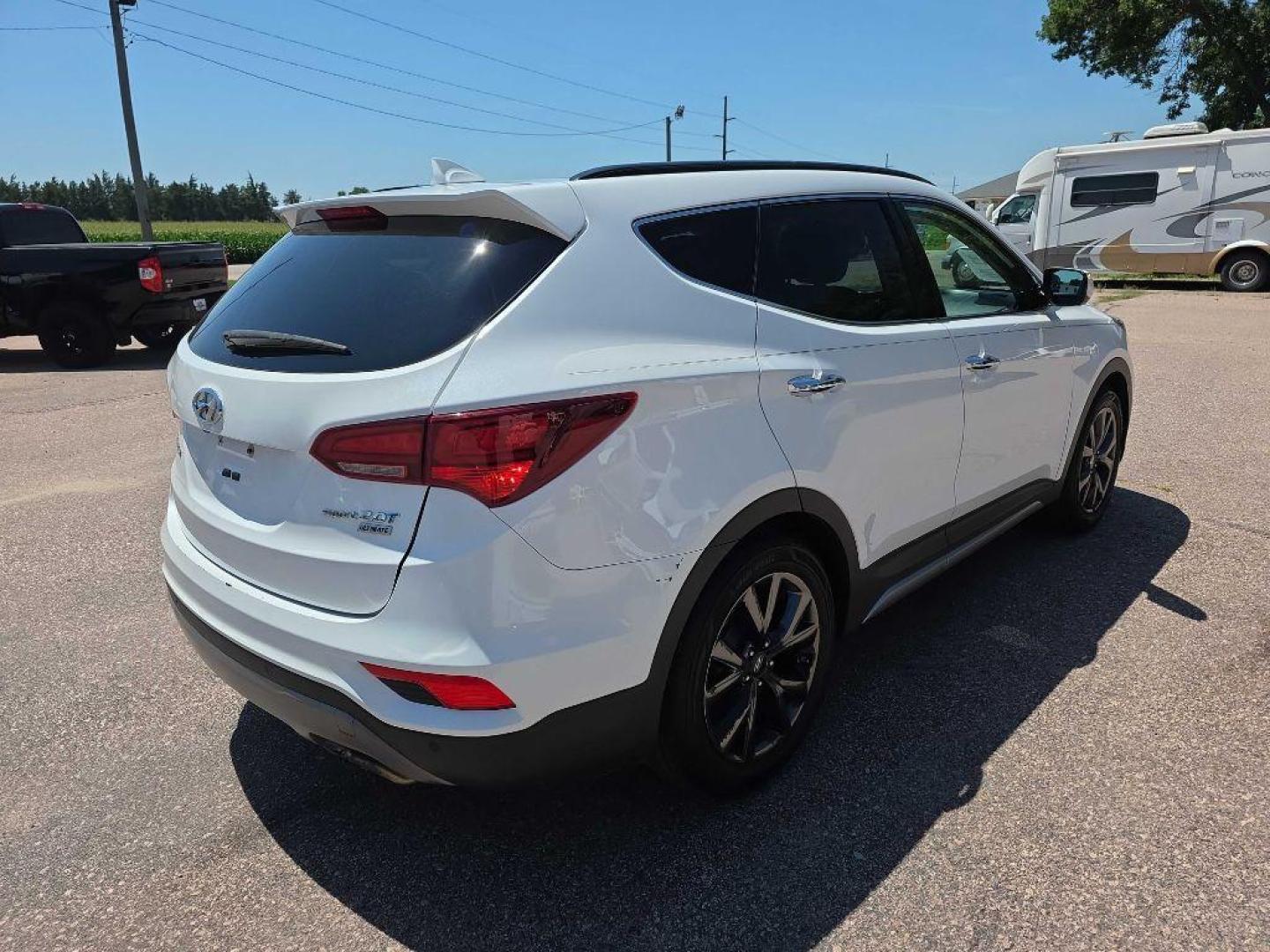 2017 WHITE HYUNDAI SANTA FE SPORT (5XYZW4LA4HG) with an 2.0L engine, Automatic transmission, located at 495 Old Highway 20 West, South Sioux City, NE, 68776, (402) 494-2677, 42.458408, -96.443512 - Photo#4