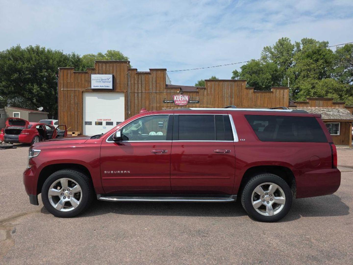 2016 MAROON CHEVROLET SUBURBAN 1500 LTZ (1GNSKJKC2GR) with an 5.3L engine, Automatic transmission, located at 495 Old Highway 20 West, South Sioux City, NE, 68776, (402) 494-2677, 42.458408, -96.443512 - Photo#1