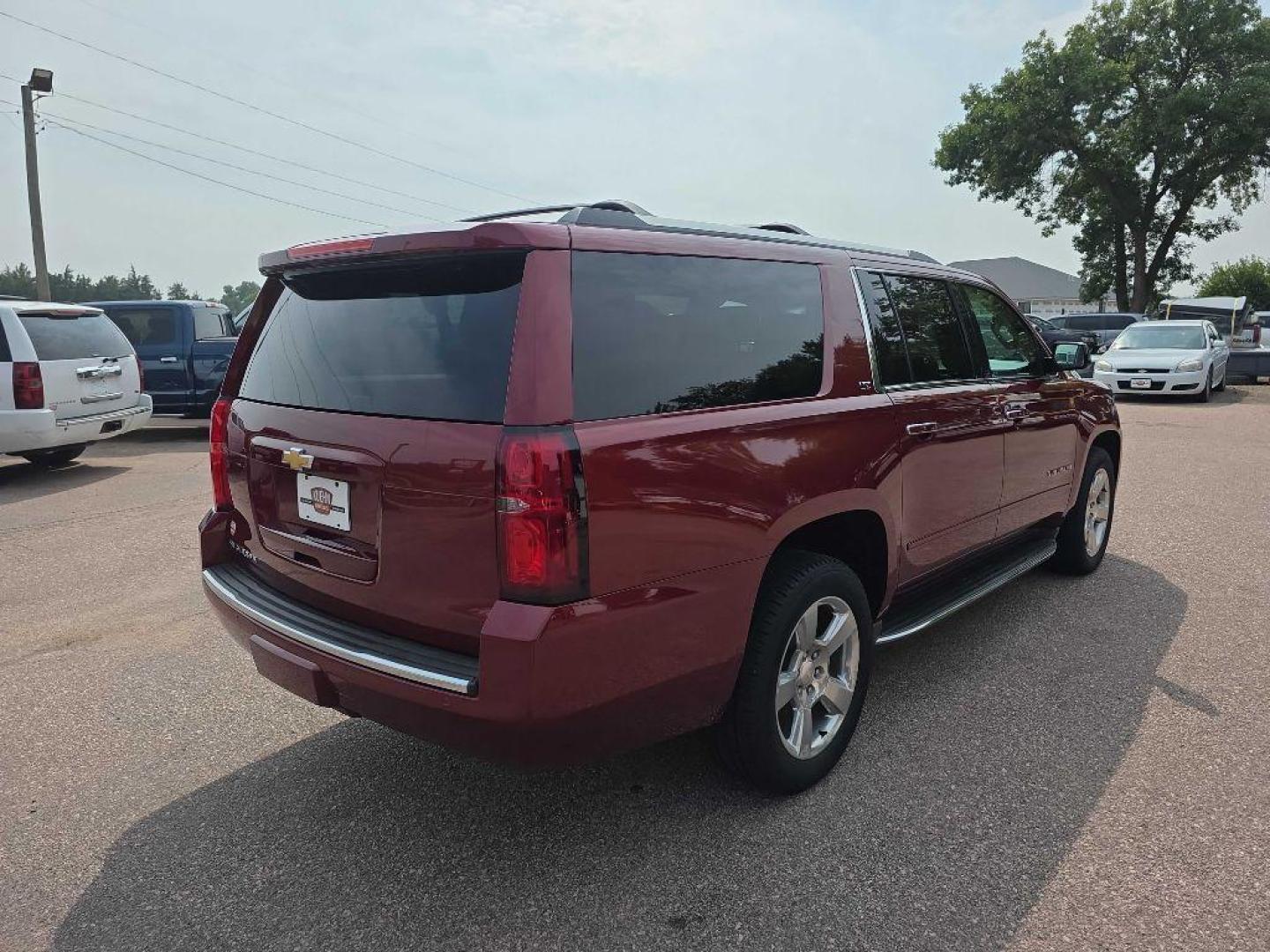 2016 MAROON CHEVROLET SUBURBAN 1500 LTZ (1GNSKJKC2GR) with an 5.3L engine, Automatic transmission, located at 495 Old Highway 20 West, South Sioux City, NE, 68776, (402) 494-2677, 42.458408, -96.443512 - Photo#3