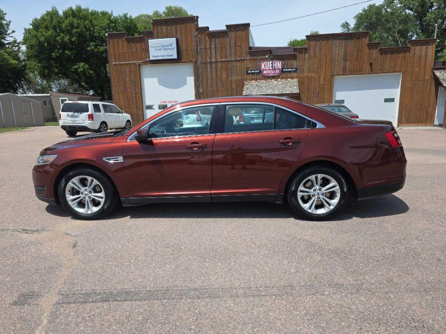 2015 MAROON FORD TAURUS SEL (1FAHP2H89FG) with an 3.5L engine, Automatic transmission, located at 495 Old Highway 20 West, South Sioux City, NE, 68776, (402) 494-2677, 42.458408, -96.443512 - Photo#0