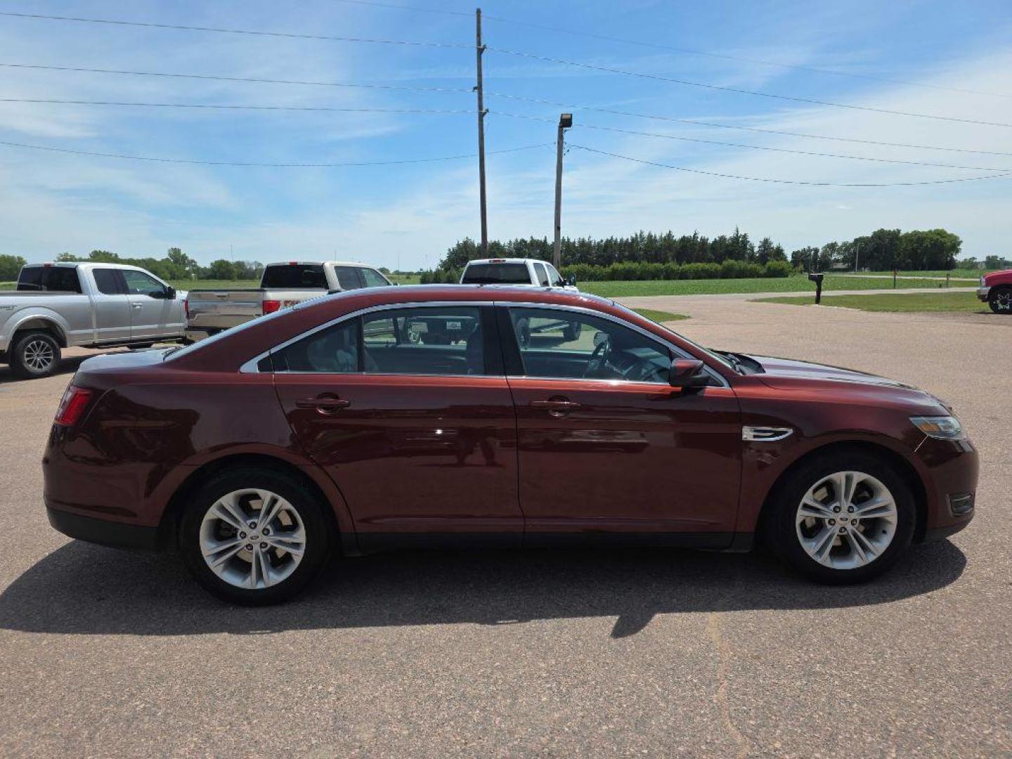 2015 MAROON FORD TAURUS SEL (1FAHP2H89FG) with an 3.5L engine, Automatic transmission, located at 495 Old Highway 20 West, South Sioux City, NE, 68776, (402) 494-2677, 42.458408, -96.443512 - Photo#1